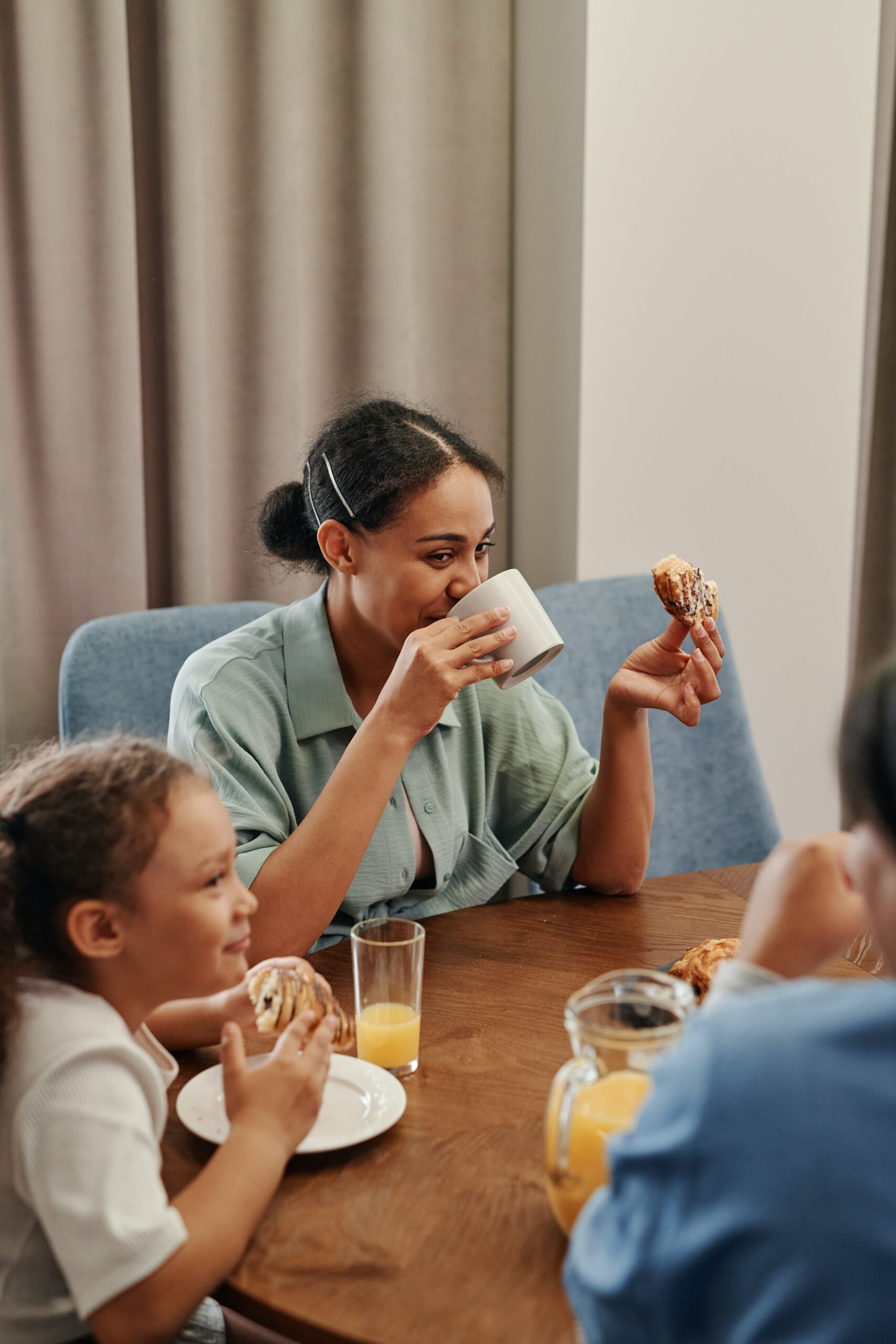 Image of woman eating with her family